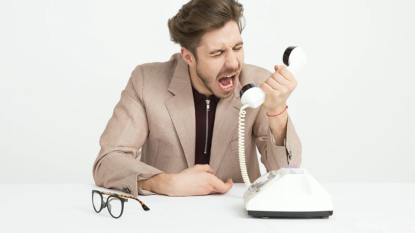 Phone ringing on a busy desk, representing missed calls as customer voice