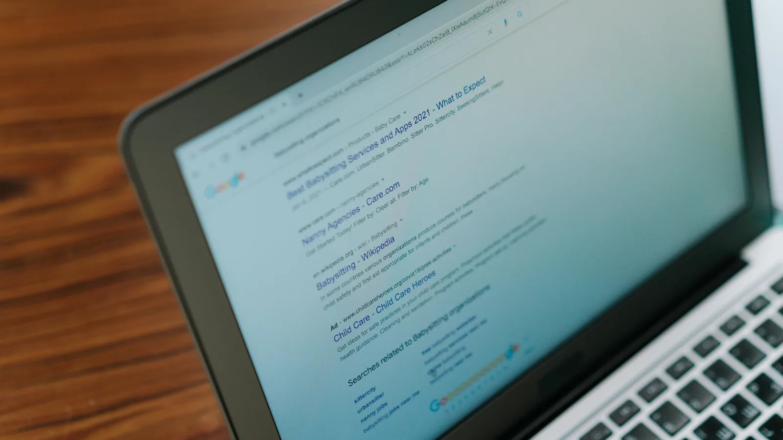 A laptop with Google Ads dashboard and a mobile phone