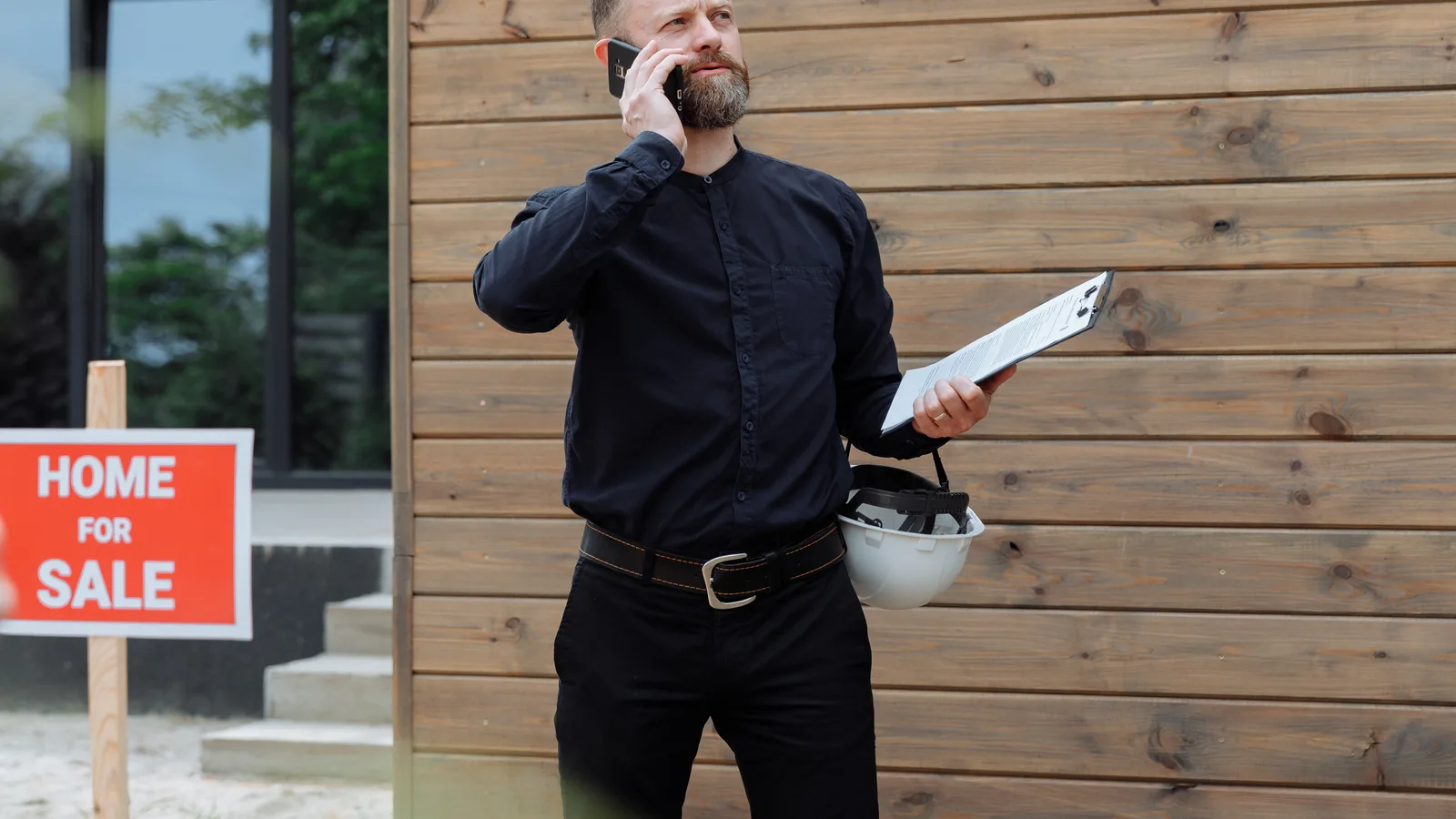 Australian real estate agent reviewing buyer enquiries on a tablet